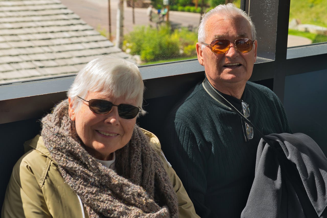 Old couple wearing sunglasses outside