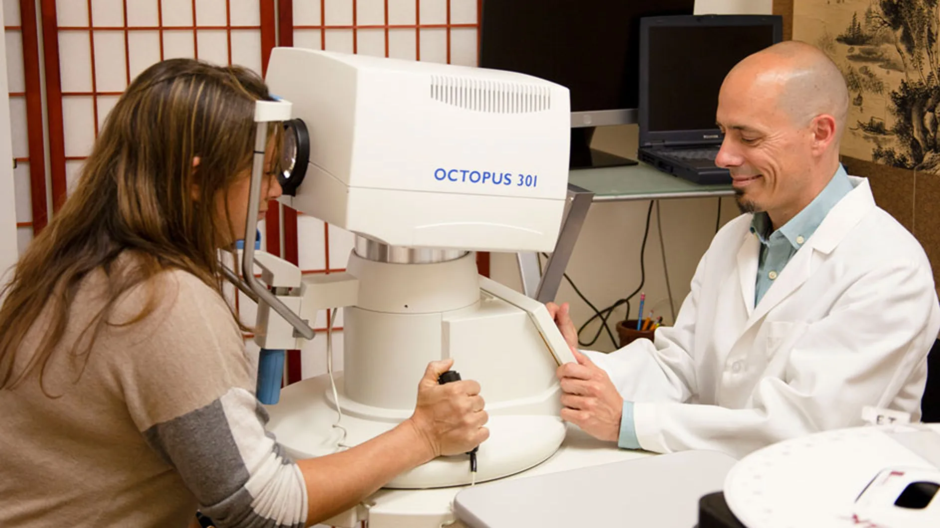 Patient undergoing visual field test on an OCTOPUS 301 perimeter